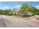 Well-maintained home boasts lush landscaping and a welcoming driveway at 401 Kenley Ct, Mcdonough, GA 30253