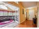 Welcoming foyer leads to a sunroom and features wood flooring at 401 Kenley Ct, Mcdonough, GA 30253