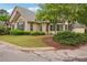 Beautiful stone home featuring lush greenery and a well-kept lawn at 401 Kenley Ct, Mcdonough, GA 30253