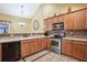 The modern kitchen features stainless steel appliances, a stylish backsplash, and granite countertops at 401 Kenley Ct, Mcdonough, GA 30253