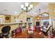 Bright and open living space with a fireplace, breakfast bar, and access to other living spaces at 401 Kenley Ct, Mcdonough, GA 30253