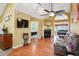 Inviting living room with vaulted ceiling, fireplace, hardwood floors, and seamless access to the bedroom at 401 Kenley Ct, Mcdonough, GA 30253