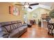 Open-concept living area featuring hardwood floors, neutral walls, and a comfortable seating arrangement at 401 Kenley Ct, Mcdonough, GA 30253