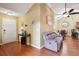 Inviting living room with hardwood floors, a cozy seating area, and open access to dining space at 401 Kenley Ct, Mcdonough, GA 30253