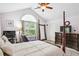 Sun-filled main bedroom with high ceilings, a large window, and a cozy reading nook at 401 Kenley Ct, Mcdonough, GA 30253