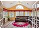 Bright sunroom with large windows, vaulted ceiling and a plush leather sofa at 401 Kenley Ct, Mcdonough, GA 30253