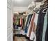 Walk-in closet with shelving, hanging racks, and ample storage space for clothes and accessories at 401 Kenley Ct, Mcdonough, GA 30253