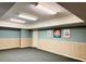 Finished basement space with painted walls, wood paneling, and ceiling lights at 1019 Henna Se Ct, Conyers, GA 30013