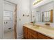 Bathroom featuring a vanity with a beige countertop and access to a toilet at 1019 Henna Se Ct, Conyers, GA 30013