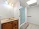 Bathroom showcasing a walk-in shower, vanity with drawers, and light fixtures at 1019 Henna Se Ct, Conyers, GA 30013