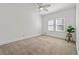 Bright bedroom with a plant, carpet and natural lighting at 1019 Henna Se Ct, Conyers, GA 30013