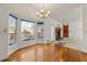 Sunlit dining area features hardwood floors, a bay window, and backyard views at 1019 Henna Se Ct, Conyers, GA 30013