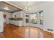 Charming dining area features hardwood floors, bay window, and adjacent kitchen space at 1019 Henna Se Ct, Conyers, GA 30013