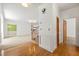 Inviting foyer featuring hardwood floors, elegant trim, and an open staircase at 1019 Henna Se Ct, Conyers, GA 30013