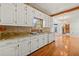 Charming kitchen features custom cabinets, granite countertops, and stainless steel appliances at 1019 Henna Se Ct, Conyers, GA 30013