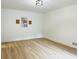 Bright living room with light wood flooring and modern lighting fixture at 1019 Henna Se Ct, Conyers, GA 30013