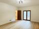 Bright living room with light wood flooring and glass patio doors at 1019 Henna Se Ct, Conyers, GA 30013