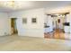 Inviting living room showcasing a spacious layout with seamless transition to the modern kitchen at 1019 Henna Se Ct, Conyers, GA 30013