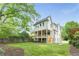 Manicured backyard with a view of a two-story home's exterior, showing the spacious lawn and tasteful landscaping at 1211 Reeder Ne Cir, Atlanta, GA 30306