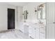 Bright bathroom with dual vanities, quartz countertops, modern lighting, and a separate water closet providing privacy at 1211 Reeder Ne Cir, Atlanta, GA 30306