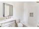 Bright bathroom with a walk-in shower, a tub, white subway tile, and sleek fixtures at 1211 Reeder Ne Cir, Atlanta, GA 30306