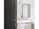 Stylish bathroom featuring a modern mirror, elegant fixtures, and a marble countertop at 1211 Reeder Ne Cir, Atlanta, GA 30306
