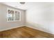 Bedroom features hardwood floors, a window and neutral paint with white trim at 1211 Reeder Ne Cir, Atlanta, GA 30306