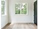 Bright bedroom with two windows and hardwood floors, creating a warm and inviting atmosphere at 1211 Reeder Ne Cir, Atlanta, GA 30306