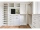 Bright, organized walk-in closet with custom shelving, drawers, and mirrored accents, perfect for maximizing storage space at 1211 Reeder Ne Cir, Atlanta, GA 30306