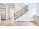 Bright entryway features hardwood floors, a staircase with black railings, and built-in cabinets at 1211 Reeder Ne Cir, Atlanta, GA 30306