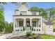 Beautiful two-story painted brick home with a manicured front yard and covered front porch at 1211 Reeder Ne Cir, Atlanta, GA 30306