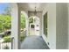 Cozy porch featuring a stone floor, brick columns, and views of the surrounding neighborhood at 1211 Reeder Ne Cir, Atlanta, GA 30306