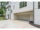 Spacious three-car garage with a clean, modern design, complementing the home's exterior at 1211 Reeder Ne Cir, Atlanta, GA 30306