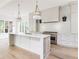 New gourmet kitchen with a large island, stainless steel appliances, and custom cabinets at 1211 Reeder Ne Cir, Atlanta, GA 30306