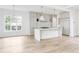 Spacious kitchen features a center island, stainless steel appliances, and gray cabinets with gold hardware at 1211 Reeder Ne Cir, Atlanta, GA 30306