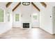 Living room featuring exposed beams, fireplace, hardwood floors and lots of windows at 1211 Reeder Ne Cir, Atlanta, GA 30306