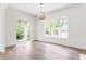 Bright living room with hardwood floors, large windows, and views of the front yard at 1211 Reeder Ne Cir, Atlanta, GA 30306