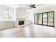 Spacious living room featuring a fireplace, built-in cabinets, and sliding glass doors at 1211 Reeder Ne Cir, Atlanta, GA 30306