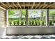 Serene outdoor view through the home's living space featuring lush greenery and neighboring houses at 1211 Reeder Ne Cir, Atlanta, GA 30306