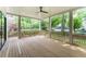 Covered porch with wood flooring, white columns and railings, and access to the backyard at 1211 Reeder Ne Cir, Atlanta, GA 30306