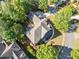 Beautiful aerial shot of a home nestled among trees, showcasing its roof and surrounding yard at 3134 Hudson Pond Ln, Marietta, GA 30062