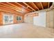 Unfinished basement with exposed ceiling, concrete floors, and a walkout to the exterior at 3134 Hudson Pond Ln, Marietta, GA 30062