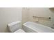 Accessible bathroom with a tub and toilet at 3134 Hudson Pond Ln, Marietta, GA 30062