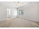 Bedroom featuring neutral walls, carpeting, and a window for natural light at 3134 Hudson Pond Ln, Marietta, GA 30062