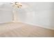 Spacious carpeted room with a ceiling fan and neutral-toned walls, offering a bright and airy atmosphere at 3134 Hudson Pond Ln, Marietta, GA 30062