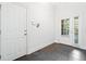 Tile foyer with transom windows and access to the main entry door at 3134 Hudson Pond Ln, Marietta, GA 30062