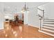 Open kitchen with a large island, stainless appliances, and a view of the staircase at 3134 Hudson Pond Ln, Marietta, GA 30062