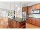 Spacious kitchen with a central island, stainless steel appliances, and wood cabinets at 3134 Hudson Pond Ln, Marietta, GA 30062