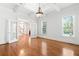 Living room featuring hardwood floors, French doors, and large windows with views of nature at 3134 Hudson Pond Ln, Marietta, GA 30062