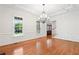 Bright living room with hardwood floors, crown moulding and natural light from the large window at 3134 Hudson Pond Ln, Marietta, GA 30062